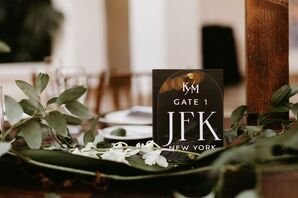 Table Number in the Style of a Gate Number and an Airport Code for Travel Couple