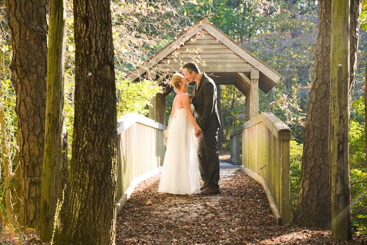 After their outdoor nuptials and ring-warming ceremony, Stephanie and Michael slipped away for a few moments with Delaney Dobson Photography. While they had a natural-themed wedding, this moment let them take it all in. The tree-lined bridge at Lakeside Clubhouse Wedding & Reception Facility in Medford, New Jersey, served as a sweet and fitting backdrop while the couple shared a kiss.