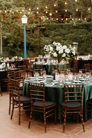 Round Tables With Emerald Green Linens, Tall Centerpieces With White Flowers at Black Tie Reception