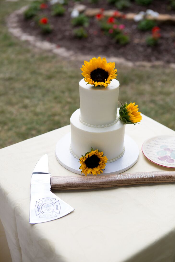 The newlyweds used a fireman axe (etched with their names and the date of their elopement) to cut their wedding cake outside the well-known Door County Confectionery in Fish Creek.