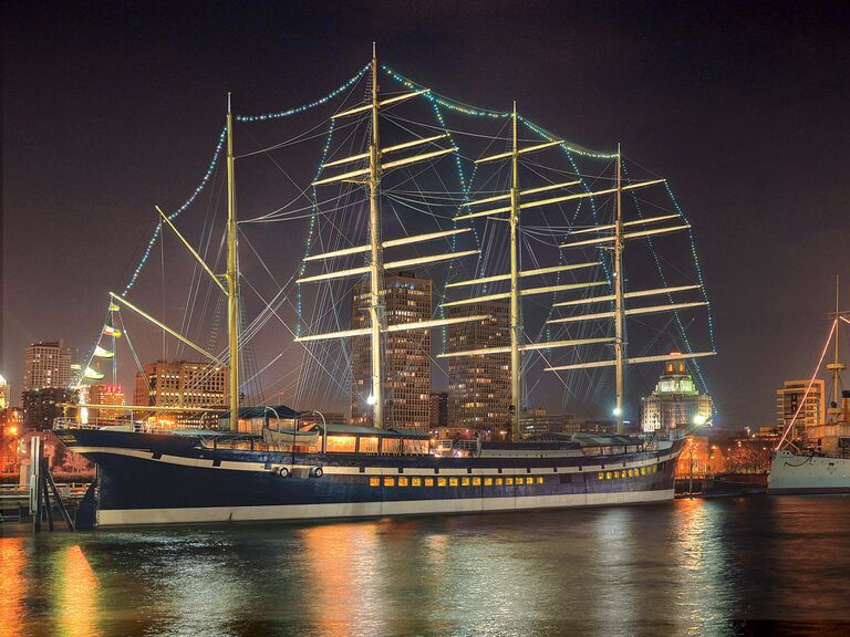 Outside view of The Moshulu wedding venue on the water at night