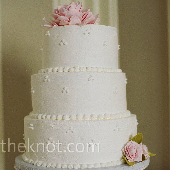 Gorgeous sugar peonies with chartreuse leaves transformed the white-frosted cake with a Swiss dot design into an elegant centerpiece.