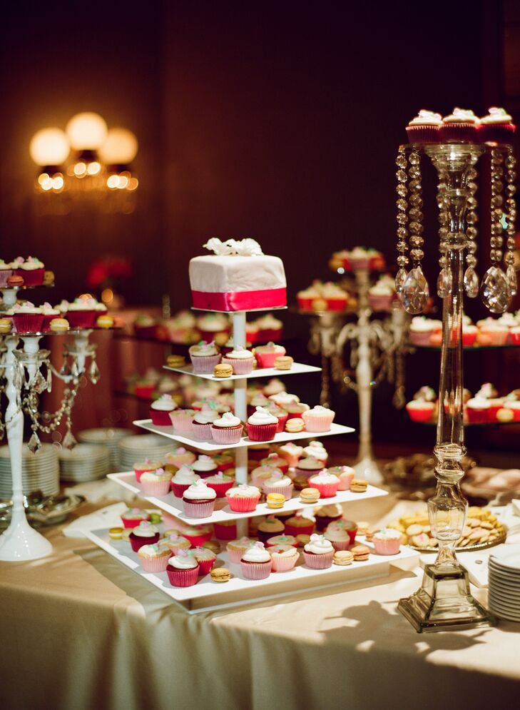 The couple served cupcakes, macarons and other sweets instead of a traditional cake. A Piece of Cake made a top tier of a cake just for the couple.