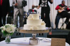 Simple Three-Tier Wedding Cake With White Flower Accents