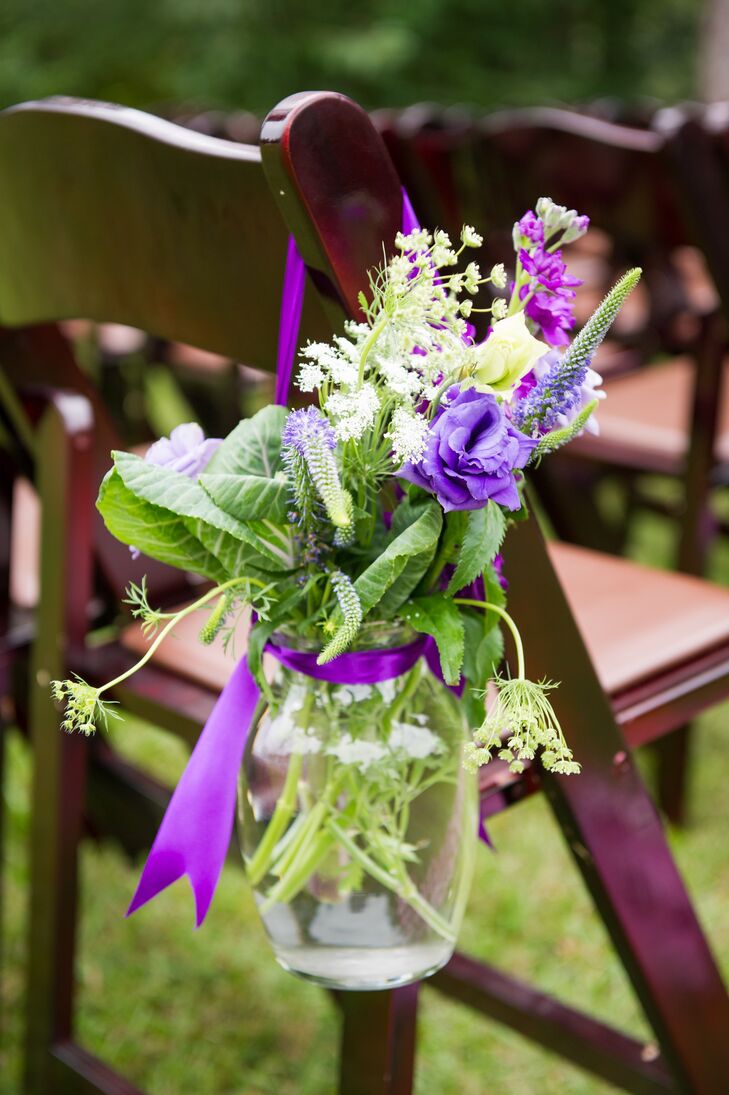 The ceremony aisles were marked with DIY Mason jar bouquets of babies breath, roses and veronica.