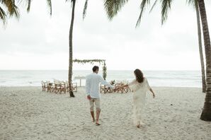 Bride and Groom Walk By Beachfront Wedding Ceremony Set Up