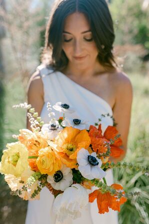 Bride in One-Shoulder Gown Holding Colorful Bouquet of Orange, Yellow and White