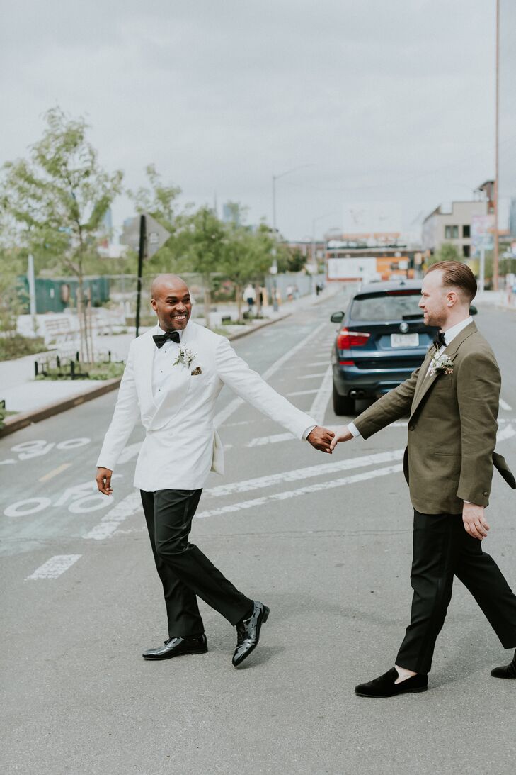 Grooms in Different Suits Hold Hands and Cross a New York Street
