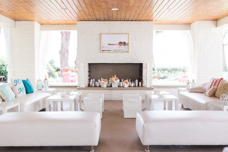 Guests who wanted to stay away from the sand and sun were welcome to go inside for a refreshing drink during cocktail hour. Rows of white modern lounge furniture, couches and short square stools were set up for their family and friends.