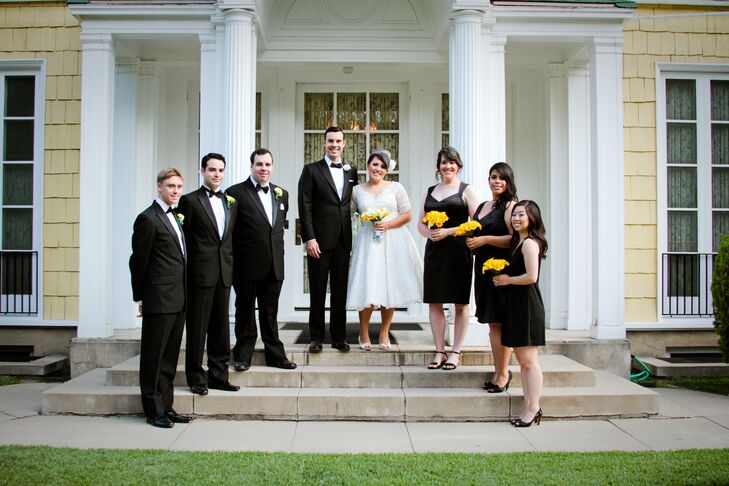 Brandy and John stood with their wedding party on the steps of the Lindley-Scott House in Azusa, California, where the couple got married. The bridesmaids wore simple black cocktail dresses and held their bouquets of canary yellow calla lilies. The groomsmen wore vintage-inspired black tuxedos from the Great Gatsby Collection by Brooks Brothers.