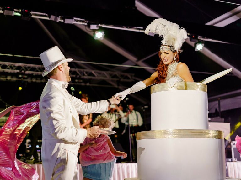 Bride jumping out a fake wedding cake. 