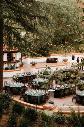 Outdoor Reception Under String Lights With Emerald, Black Linens, Elegant Decor