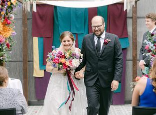 Caroline and Mike initially imagined "having a 250+ person evening winter wedding with all of our friends and family, tons of dancing, and a big brida