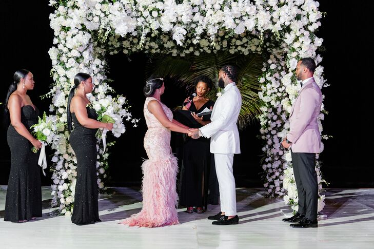 Wedding Ceremony With White Floral Arch