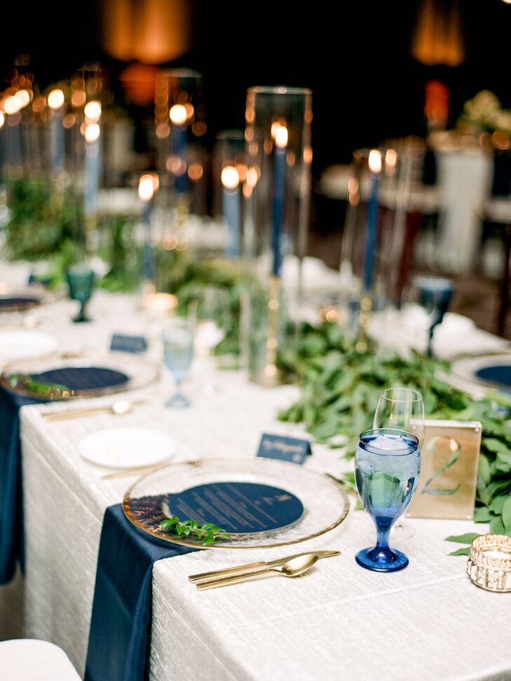 Navy was incorporated in the winter wedding through taper candles, goblets, menus and napkins.