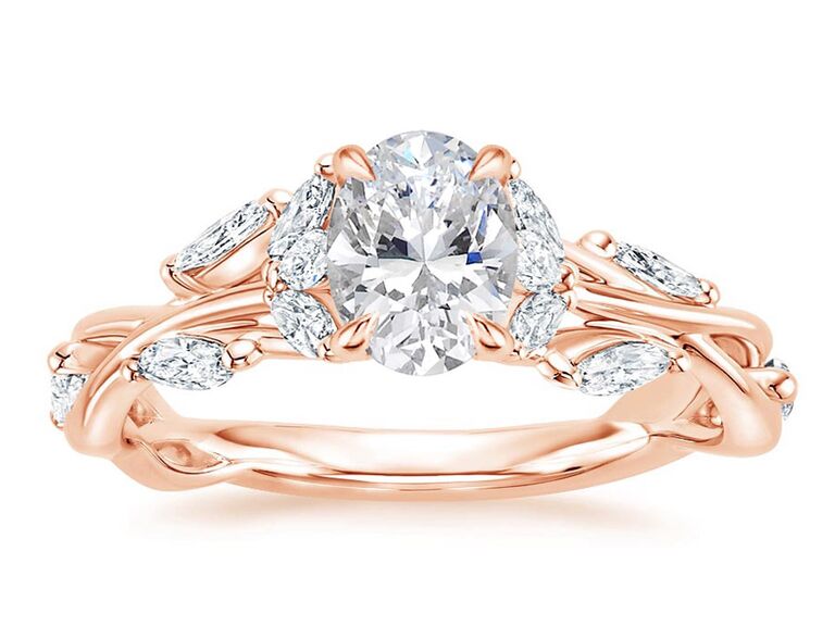 brilliant earth rose gold engagement ring with oval diamond center stone claw prongs marquise side diamonds and rose gold twist band