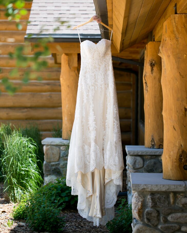 The bride wore a vintage ivory lace wedding dress complete with a champagne gold underlay. To finish the look, she paired the vintage find with ivory Tom's wedges.