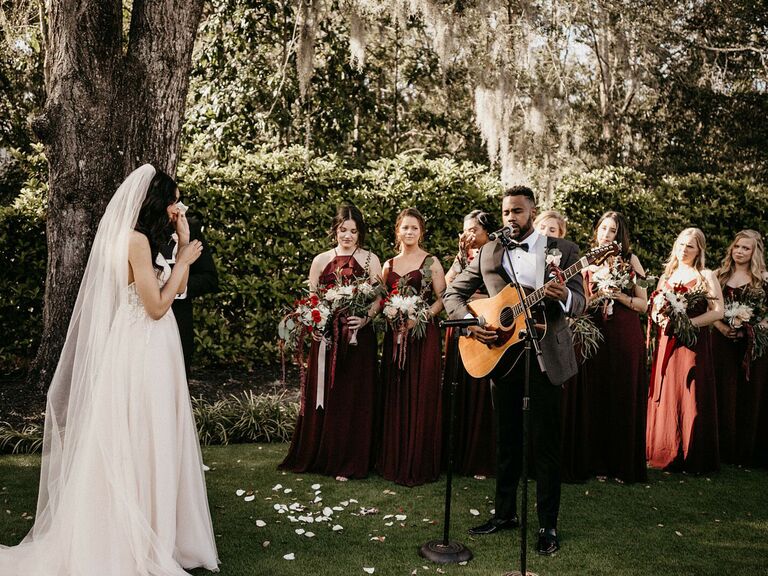 friends themed wedding groom serenading bride