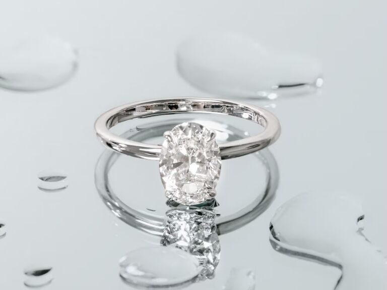 oval solitaire platinum engagement ring with sleek band