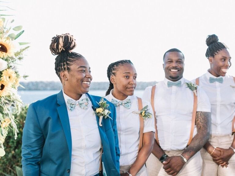 bride and wedding party standing during ceremony