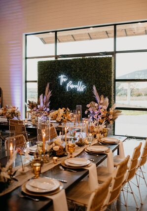 Modern Bohemian Reception with Greenery Wall and Neon Sign