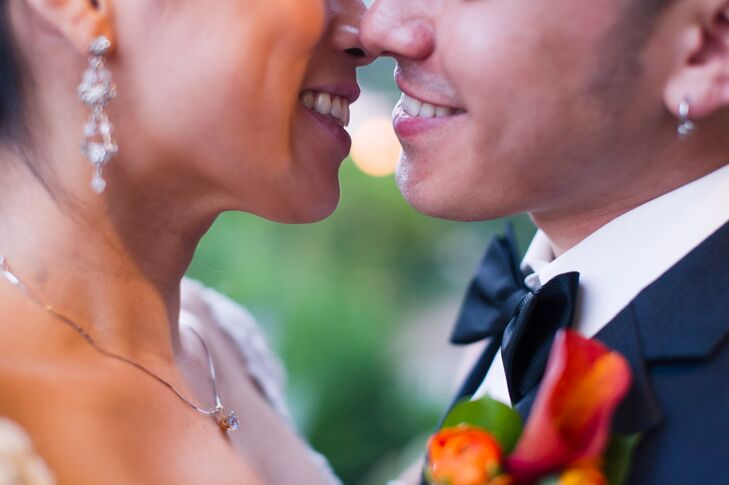 Orange and Red Calla Lily Boutonniere with a Contrasting Charcoal Bow Tie
