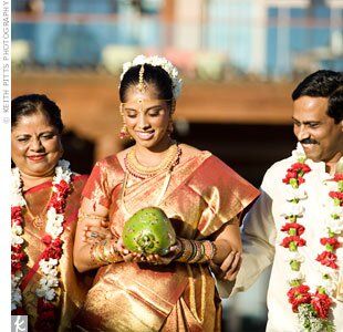 Harini held a beautifully painted coconut (a symbol of fertility) as her parents escorted her down the aisle.