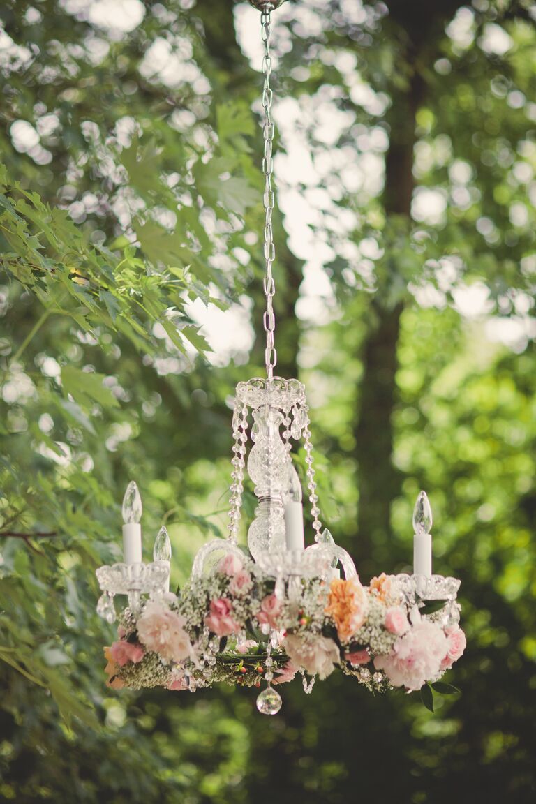 Outdoor chandelier with garland of roses and baby's breath