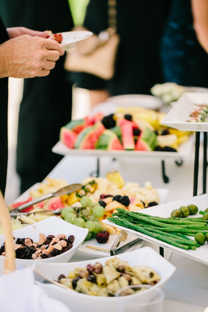 During cocktail hour, guests were treated to a variety of foods including fresh fruit and Italian dishes. If they weren't eating they could wander over to the photo booth for pictures or play a game of corn hole on the lawn.