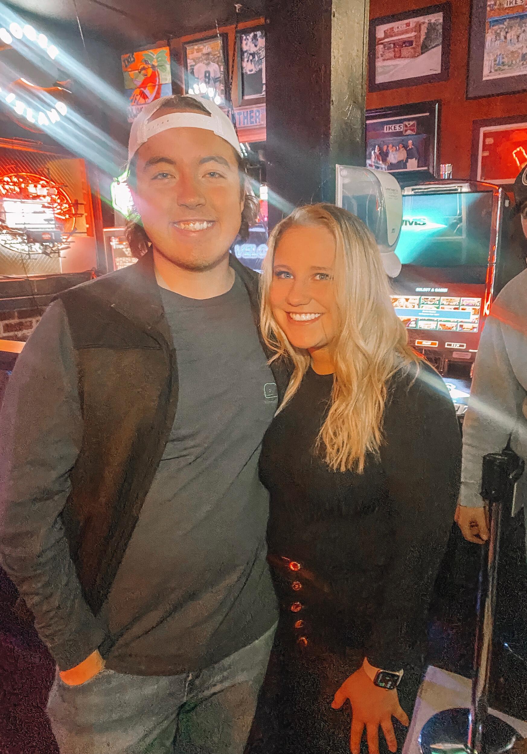 Two "friends" at their favorite bar, Ikes! They started dating a few days after this picture was taken. 