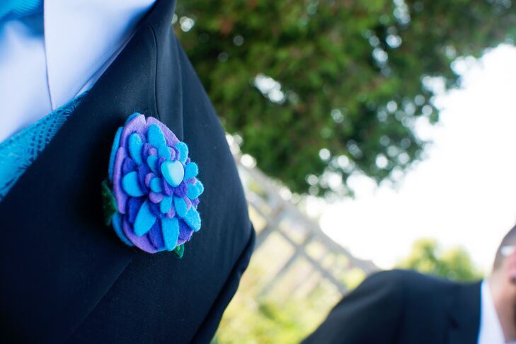 The groomsmen wore purple and blue felt flower boutonnieres to match the felt flower bouquets.