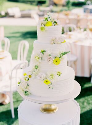White Wedding Cake With Yellow Cake Flowers