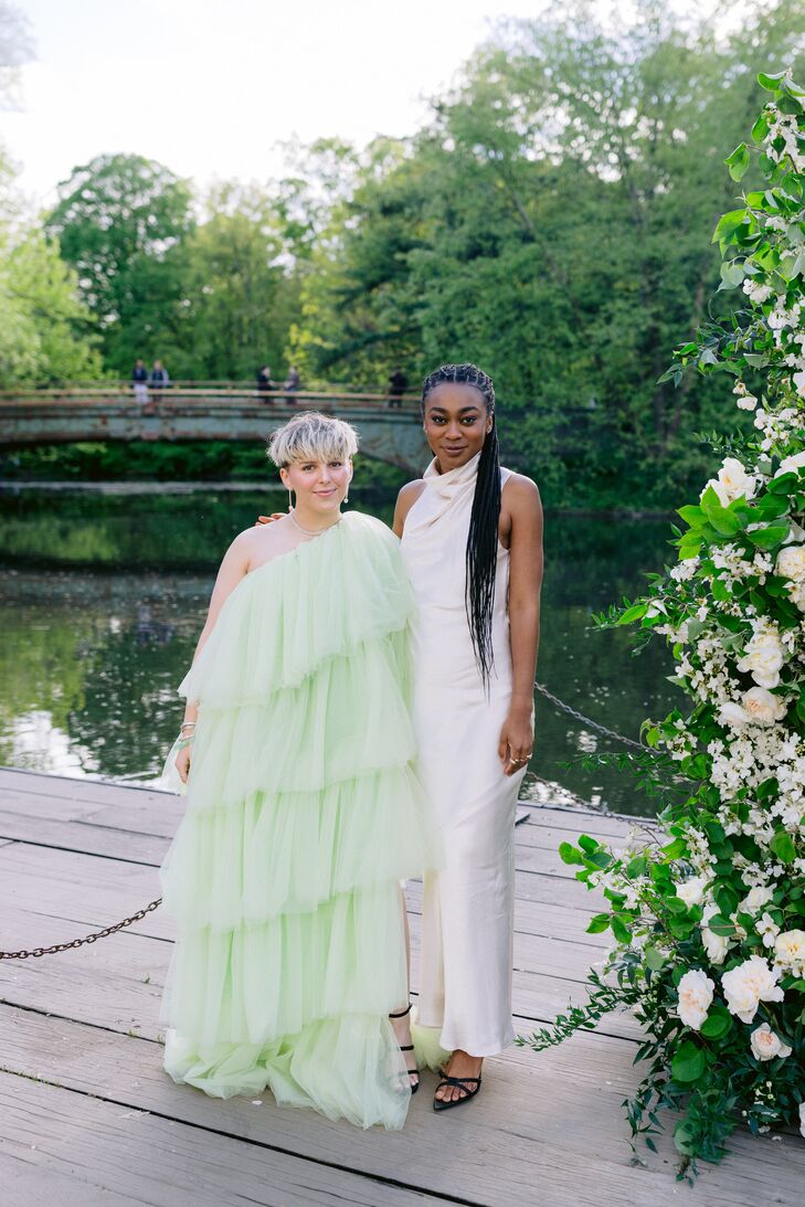 Wedding Guests in a Layered, Fashion Green Dress and a Sleek, Chic White Satin Dress on Dock