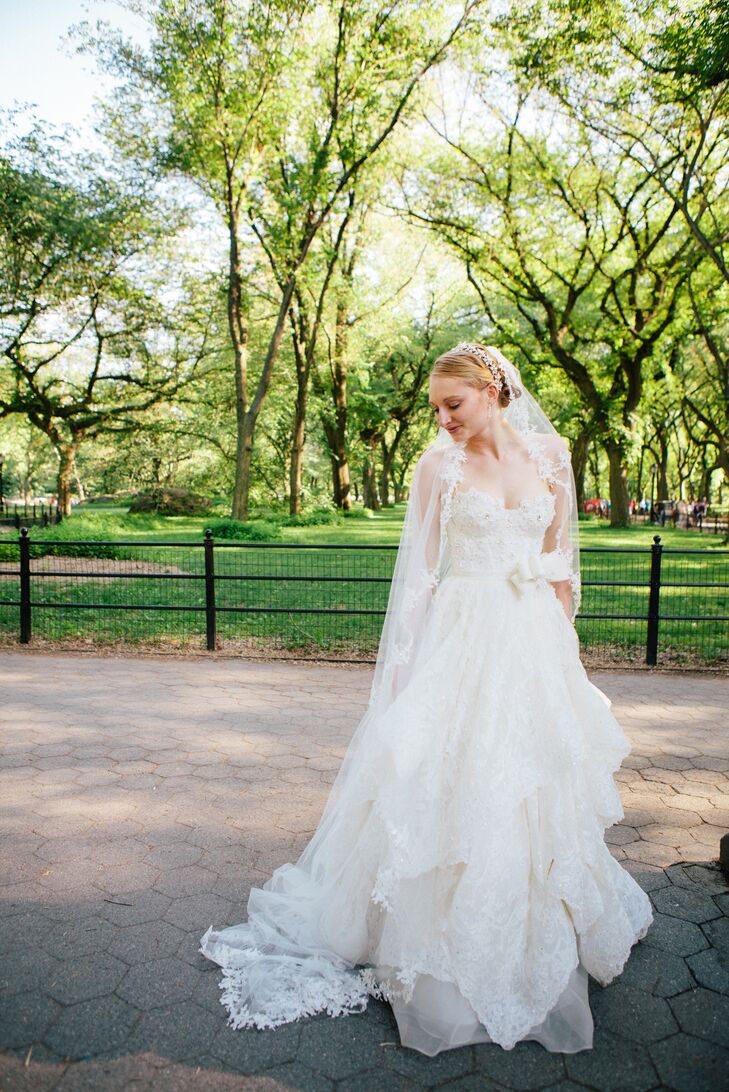Katie’s wedding dress from Kleinfeld definitely had a "wow" factor. She wore a one-of-a-kind Pnina Tornai wedding dress covered in delicate floral appliques from the fitted bodice to her flowy, tiered skirt. The floral appliques with her custom cathedral veil matched her elegant crystal tiara to complete her sophisticated, ethereal style.