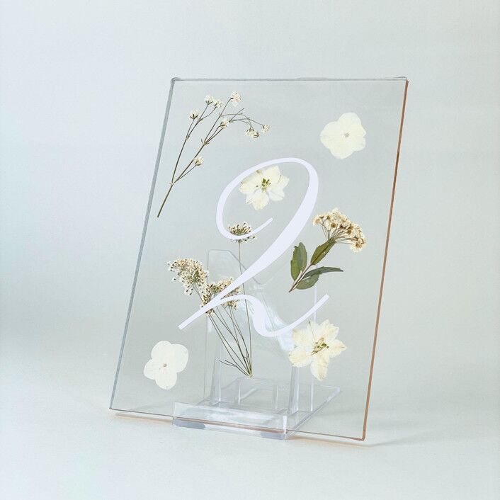modern acrylic wedding table number with white calligraphy and pressed flowers