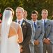 Bryan stood across from Jackie during the ceremony with his groomsmen behind him. Bryan stood out wearing his custom-made charcoal gray suit designed by Balani Custom Clothiers, while his groomsmen wore lighter gray suits designed by JoS. A. Bank.