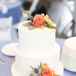 Buttercream Wedding Cake With Coral Roses