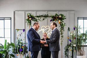 Grooms Beside Wedding Arch