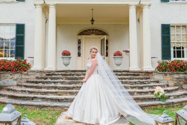 Katie's Alita Graham ball gown had a large chiffon skirt and crystal beading details. She paired the vintage inspired gown with a cathedral-length veil.