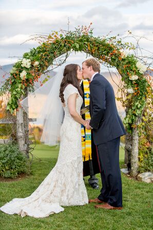 Fall Wedding Arch With Greenery and Orange Flowers