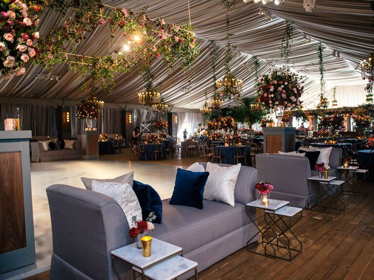 Wedding tent with gray drapes and hanging candles