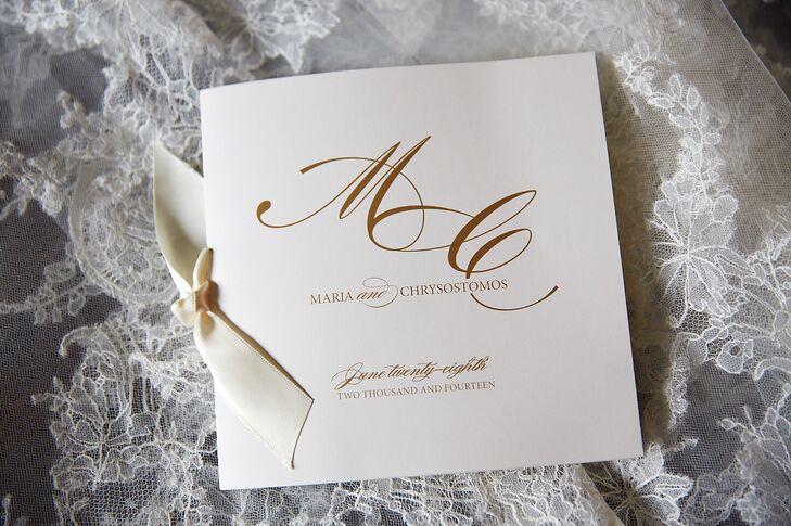 To match the classically elegant look of their wedding, Maria and Chris's ceremony programs were ivory stationery with chic gold typography. The program booklets were tied with satin ribbons for a little added romance.
