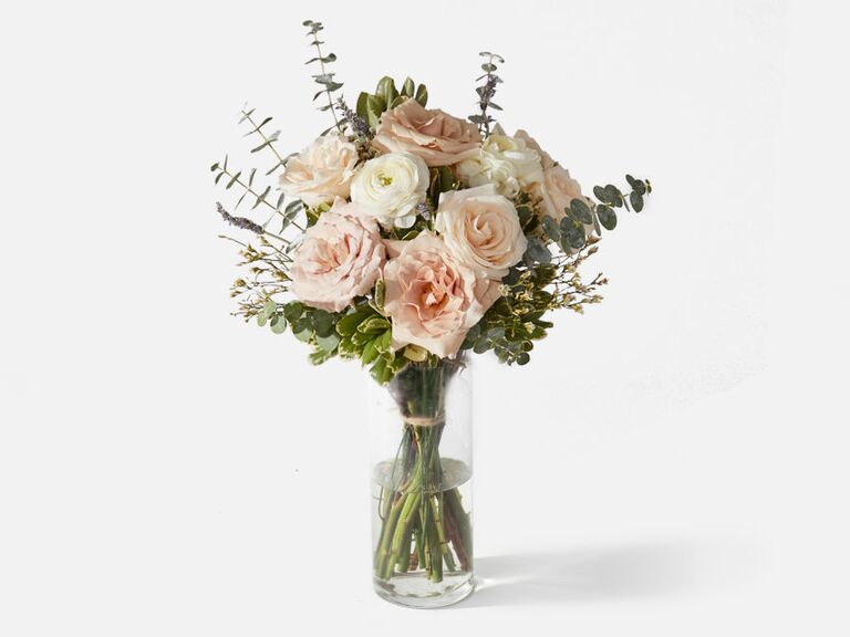 Bouquet of white and pink roses in a glass vase last-minute anniversary gift