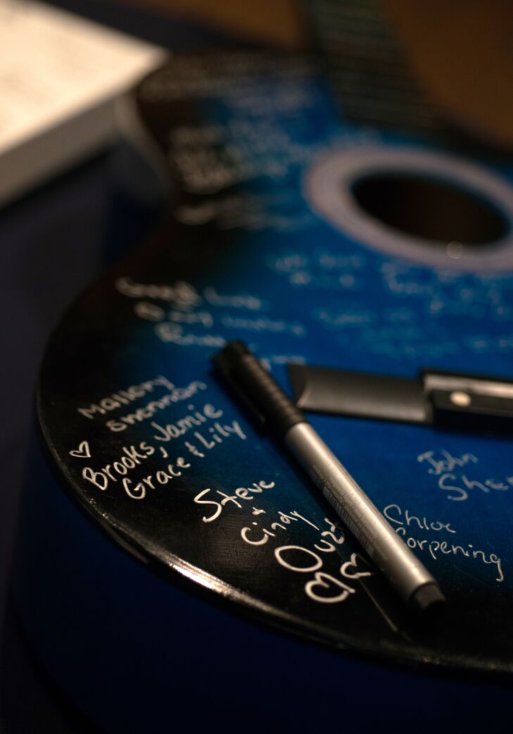 Instead of a traditional guest book, guests signed an acoustic guitar, a nod to Josh's love of music, which the couple would be able to enjoy for years after the wedding.