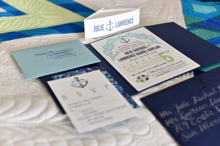 Their custom-made white stationery had text and anchor designs printed in blue and green. The stationery followed the relaxed color palette, which was inspired by the chuppah at the wedding. The invitations were sealed inside blue envelopes and sent to guests.