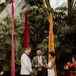 Bride in Gold Headpiece, Bright Tropical Bouquet and Groom in White Tux Jacket, Black Trim