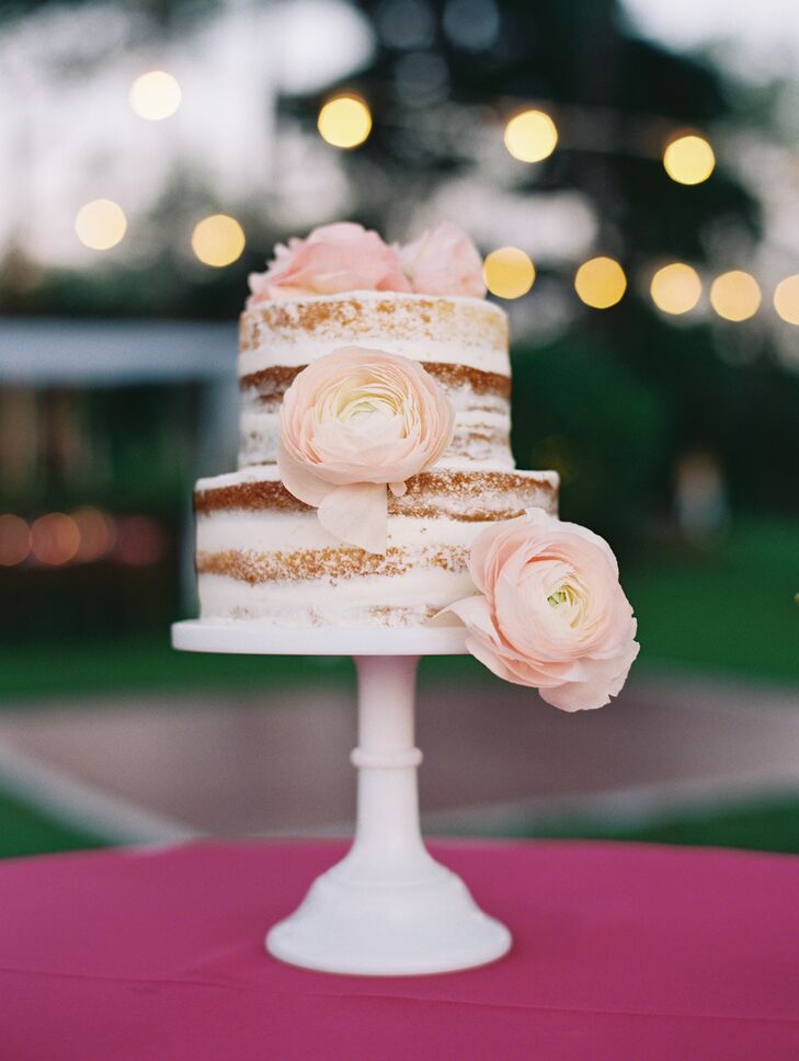 Subtle peach garden roses adorned the two-tier cake from Maui Sweet Cakes bakery.