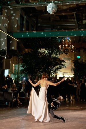 Bride and Groom Doing Elaborate Dance Under Disco Ball at Edgy, Warehouse Reception