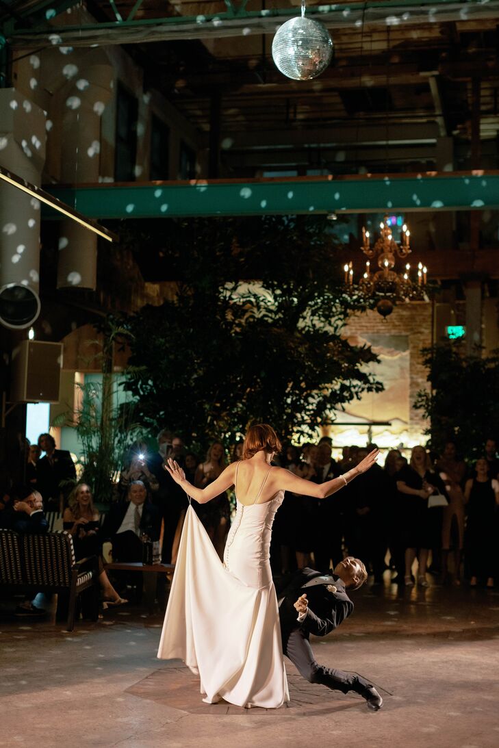 Bride and Groom Doing Elaborate Dance Under Disco Ball at Edgy, Warehouse Reception