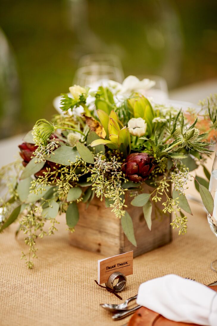 Dave and Chad kept flower arrangements to the minimum to let the natural beauty of the farmhouse speak for itself. The centerpieces, however, incorporated square wooden boxes filled with a variety of brunia, anemones, and even artichokes!